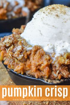 pumpkin crisp in a cast iron skillet topped with whipped cream