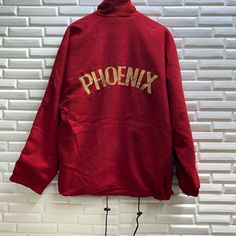 "PLEASE READ DESCRIPTION BELOW BEFORE BUYING👇🏻 *ITEM:Vintage Phoenix Fleece Jacket *ITEM DETAILS: 👇🏻 Please be aware that all vintage items will usually show a few signs of wear or fading due to age, but anything visible such as stains or holes, and serious flaws have been photographed.For any further information on this item please contact us and we will be happy to help. *SIZE:LARGE *ACTUAL SIZE MEASUREMENT: 👇🏻 *PIT TO PIT(WIDTH):25\"INCHES *LENGTH(FROM SHOULDER): 30\"INCHES *ALL MEASURE Vintage Fleece Long Sleeve Outerwear, Vintage Fleece Jacket For Fall, Vintage Hooded Fleece Outerwear, Red Vintage Windbreaker For Winter, Vintage Fleece Jacket For Winter Streetwear, Vintage Winter Fleece Jacket For Streetwear, Vintage Fleece Jacket For Fall Streetwear, Winter Crew Neck Outerwear With Embroidered Logo, Vintage Long Sleeve Fleece Jacket For Streetwear