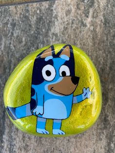 a rock with a cartoon character painted on it