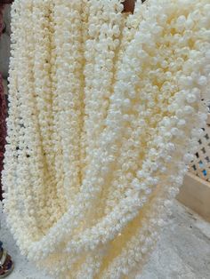 a bunch of white flowers sitting on top of a table