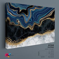 an abstract painting with blue, gold and white colors on it's canvases