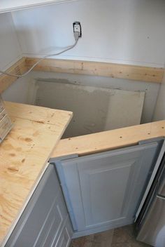 the unfinished kitchen counter is being installed