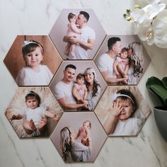 a family photo collage on a marble table with white flowers in the foreground