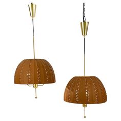 two lamps that have been made to look like they are hanging from the ceiling and one is