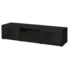 a black entertainment center with two doors and one shelf on the bottom, in front of a white background