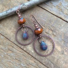 Burnt orange dangle earrings with rustic teardrop dangle and antiqued copper.Small, light-weight copper and Czech glass earrings that are perfect for your fall jewelry collection! The Czech glass is a beautiful, rustic, faceted burnt orange focal piece with a small glass teardrop dangle and antiqued copper ring.Product overview:- Made with Czech glass and antiqued copper- Total hanging length is 2", the ring is the diameter of a penny- Small, versatile and light-weight- Hypoallergenic ear wires Genuine Turquoise Jewelry, Enameled Jewelry, Beading Earrings, Earthy Earrings, Orange Jewelry, Earthy Jewelry, Making Bracelets, Necklace Ideas, Orange Earrings