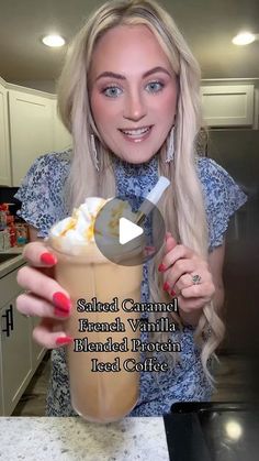 a woman holding up a cup with ice cream in it and the caption reads, salted caramel brandy blended protein iced coffee