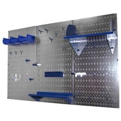 there is a metal pegboard with blue shelves on it