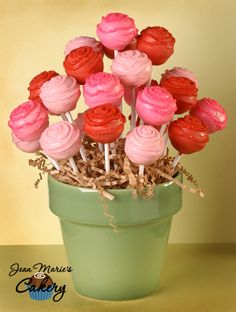 pink and red cupcakes in a green pot