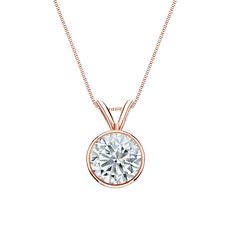 a necklace with a round cut diamond in the center, on a chain that is attached to