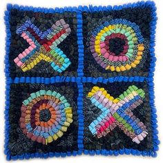 a square made out of crochet and yarn with the letter x on it