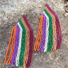 Gorgeous Handmade Seed Beaded Statement Earrings, 4 Inches Long, 1.5 Inches Wide. Glass Beads, Stainless Ear Wires. #Statementearrings #Boho #Bohojewelry #Hippie #Bohemian #Handmade #Seedbeaded #Beaded #Beads #Bohostyle Beaded Beads, Bohemian Handmade, Dusters, Hippie Bohemian, Fringe Earrings, Long Earrings, Green And Orange, Ear Wires, Boho Jewelry