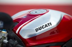 the ducati logo is visible on this motorcycle's front fenders and engine