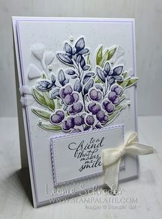 a close up of a greeting card with flowers on the front and bottom, in purple