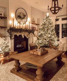 a living room filled with furniture and a christmas tree in front of a fire place