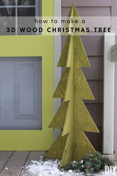 a wooden christmas tree sitting in front of a yellow door with the words how to make a 3 d wood christmas tree