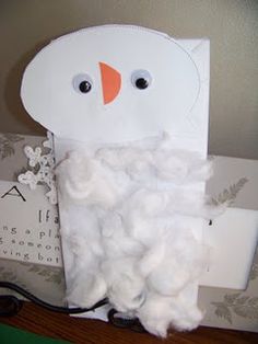 a toilet paper roll bird made to look like cotton floss