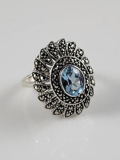 *Size 8 *Remarkable Art Deco Blue Topaz (either genuine or glass, I am unsure which) & Marcasite Ring in sterling silver. *Wonderful etching on the back of the ring. *Weighs-5.2 grams. *Stamped-Sterling. *Dates from the 1920s. This ring is around 100 years old. *Condition-Very Good Estate Condition for its age. A few Marcasite are missing, but this doesn't take away from the overall impact of this ring. *This ring looks gorgeous on the finger. *Remarkable stacked style, with halos of marcasite s Minted Art, Deco Blue, Marcasite Ring, Multi Stone Ring, Sterling Silver Bands, Multi Stone, White Topaz, Silver Band, Statement Ring