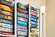 a bunch of video games are stacked on the wall