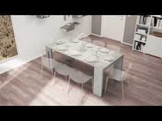 an aerial view of a dining room table and chairs