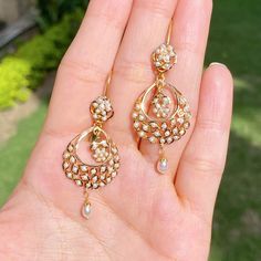 A pair of ultra lightweight, 22k gold chandbali earrings studded with pearls. The earrings weigh 7.26 gms including 0.25 gms in the hanging pearl drops Chandbali Pearl Drop Earrings, Festive Chandbali Earrings With Pearl Pendant, Festive 22k Gold Pearl Drop Earrings, Gold Chandbali Pearl Earrings, 22k Gold Pearl Drop Chandbali Earrings, 22k Gold Chandbali Pearl Drop Earrings, Yellow Gold Chandbali Pearl Drop Earrings, Elegant 22k Gold Chandbali Pearl Earrings, 22k Gold Pearl Drop Earrings