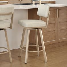 two stools in front of a kitchen counter