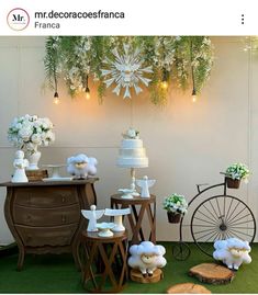 a table topped with lots of cakes and flowers