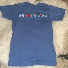 Cool Domino’s T-Shirt That Says 1960 2020 (60th Anniversary). 1960 Is When The Company Was Founded. Perfect For Pizza Lovers Or Even As A Halloween Costume. Very Soft Material No Care Tag Or Size Tag Fits Like A Small Medium Tags: Domino’s, Domino’s Pizza, Pizza, Blue, T-Shirt, Women’s Shirt, Women’s Tee, Women’s T-Shirt, Red, Domino, White, Blue Blue Short Sleeve Tops Made In Usa, Vintage Blue Tops For Fan Merchandise, Retro Blue Top With Screen Print, Domino’s Pizza, Pizza Pizza, Pizza Lovers, 60th Anniversary, Care Tag, Blue T Shirt