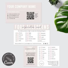 two business cards with green leaves on them