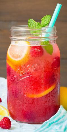 a mason jar filled with raspberry lemonade