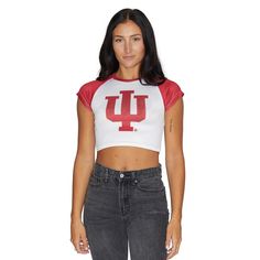 This super cropped and fitted Indiana Hoosiers tee is perfect for college game day paired! Its stretchy fabric makes it the perfect option for all body types. Stretchy and soft, you'll want to rock this top every day! Runs slightly small - order a size up if in between sizes. 95% Polyester, 5% Spandex. Cropped Fit. Sublimated Design. Machine wash on cold. Officially Licensed by Lo + Jo Bands. Casual Fitted T-shirt For Game Day, Collegiate Style Fitted Tops For Spring, Fitted Sports Tops For Team Spirit, Sporty Crop Top For College In Spring, Sporty Stretch Cropped Shirt, Sports Fan Tops For Game Day In Spring, Summer Collegiate Top For College, College Style Short Sleeve Tops For Game Day, Fitted Tops For Game Day In Spring