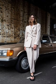 Our signature button waist shape is back this season in a soft beige marl. Cool handle this blazer is perfect for warmer weather.Tie the belt at the back for a cleaner look or wear cinched in to create an hourglass silhouette. Pair with the matching peg trousers for a modern take on suiting. Worn here by Lucy Nicholls.