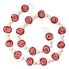 a red and white necklace, bracelet and earring set with two balls in the shape of spirals