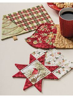 the table is set with quilted coasters and a cup of coffee