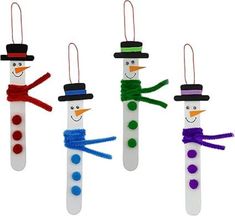 four snowmen made out of toothpicks with different colors and shapes on them