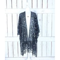 Sheer Black Net Round Black Sequin Fringe Tassel Kimono Cardigan Cover Up Measurements...Taken Flat -Size: One Size -Width Seam To Seam: 46" -Length With Fringe: 35" Features - Lightweight Sheer Black Net -Accented With Round Black Sequin -Scalloped Edges -Fringe Hem -Bohemian Gypsy Oversized Flowing Style -Generous Arm Holes Chic Fringe Cardigan, Chic Long Sleeve Fringe Cardigan, Summer Evening Long Sleeve Cardigan, Elegant Fall Party Kimono, Chic Black V-neck Kimono, Spring Black Tasseled Outerwear, Black Fringe Cardigan For Spring, Long Black Summer Cardigan, Black Fringe Cardigan For Winter