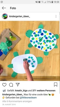 two children are making turtle crafts on the table