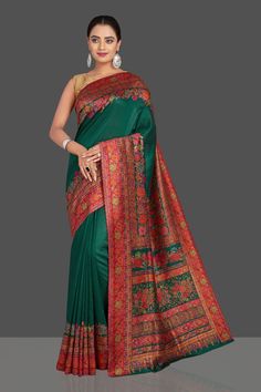 Look elegant on festive occasions in this stunning dark green Kani weave tussar muga saree. It comes with a matching blouse piece. Shop designer sarees in USA from Pure Elegance. Disclaimer: The shown stitched blouse on the model is for display purpose only. The saree comes with a matching blouse piece and finished with fall and piko. The actual product may vary slightly from the image. These are custom orders, hence expect slight variation in color, placement of the motif or buta. ESTIMATED DEL Designer Handloom Pre-draped Green Saree, Navratri Green Slub Silk Saree, Dark Green Traditional Wear With Cutdana, Green Tussar Silk Saree For Navratri, Green Semi-stitched Tussar Silk Pre-draped Saree, Green Jamawar Pre-draped Saree For Festivals, Dark Green Traditional Wear With Pallu, Green Pre-draped Saree With Meenakari For Navratri, Navratri Green Pre-draped Saree With Meenakari