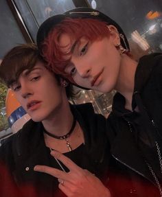 two young men with red hair posing for the camera