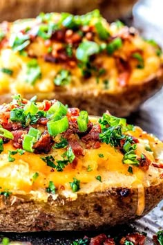 baked potatoes with bacon, cheese and green onions