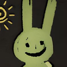 a paper cut out of a green bunny with the sun in the sky behind it