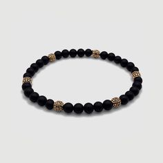 Effortless style is good manners. CRAFTD for individuality, every semi-precious Onyx stone displays its own unique markings, resulting in a truly one-of-a-kind piece. Enhanced with 18K gold beads, its relaxed aesthetic becomes the ideal companion for those essential laid-back days. Qualities: Sharpened Focus ✓ Semi-Precious Onyx Stone✓ 18K Gold & 316L Stainless Steel ✓ Water, Heat, Sweat Resistant Model is 5'11 & Wears Size 19cm. Onyx Bracelets With Natural Stones As Gifts, Onyx Bracelets With Natural Stones For Gift, Modern Polished Beads Bracelet, Elegant Gemstone Beads Crystal Bangle Bracelet, Elegant Crystal Gemstone Beads Bangle Bracelet, Elegant Crystal Bangle Bracelet With Gemstone Beads, Elegant Crystal Bangle Bracelet With Natural Stones, Modern Bracelets With Natural Stones, Modern Adjustable Jewelry With Polished Beads