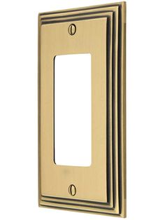 an image of a light switch plate in brass color with two plates on each side