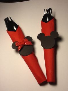 two red and black mickey mouse napkin holders