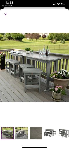 an outdoor table and benches on a wooden deck with potted plants next to it