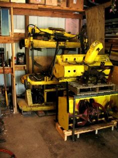 there are many yellow machinery in the garage