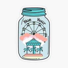 a glass jar with a ferris wheel and clouds in the sky sticker on it