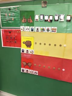 a bulletin board with pictures and magnets attached to it's sides, including thumbs up