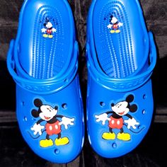 Step Into The Magic Of Disney With These Brand New 2024 Mickey Mouse Adult Clogs From Crocs. Made With The Highest Quality Materials, These Blue Clogs Feature The Iconic Mickey Mouse Ears Design, Making Them The Perfect Souvenir For Any Disney Fan. Ideal For Both Indoor And Outdoor Use, These Comfortable Clogs Are Perfect For Everyday Wear Or For Adding A Touch Of Disney Magic To Your Next Park Visit. With A Size Of M7/W9, They Are Sure To Fit Comfortably. Don't Miss Out On This Amazing Opportun Cute Blue Non-slip Clogs, Casual Mickey Mouse Clogs With Round Toe, Fun Blue Non-slip Clogs, Blue Non-slip Fun Clogs, Cute Blue Round Toe Sandals, Fun Blue Closed Toe Sandals, Playful Blue Round Toe Clogs, Blue Closed Toe Fun Sandals, Playful Blue Closed Toe Clogs