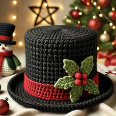 Create a charming and festive addition to your holiday wardrobe with this easy-to-follow Christmas Top Hat Crochet Pattern! Perfect for all skill levels, it includes detailed instructions for toddler, child, and adult sizes. Ideal for family photos or unique Christmas gifts, this pattern guides you through crocheting a classic top hat with a red hatband, green holly leaves, and festive red berries. Customize with extra decorations or keep it classic.   Materials Needed: - Worsted weight yarn - Crochet hook - Scissors - Tapestry needle - Optional embellishments (e.g., beads, ribbon)  Get into the holiday spirit and crochet your own Christmas Top Hat for a fun, festive, and handmade holiday look! Knitted Top Hat Pattern, Crochet Christmas Bottle Cover, Crochet Christmas Hat Free Pattern, Crochet Christmas Hat Pattern, Crocheted Christmas Decorations, Crochet Tophat, Christmas Crochet Hats, Crochet Christmas Tree Hat, Top Hat Crochet